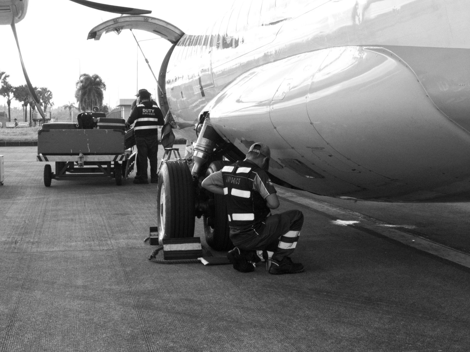 AviaCentric ground crew working beneath an aircraft